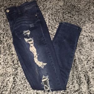 Ripped skinny jeans with fishnet